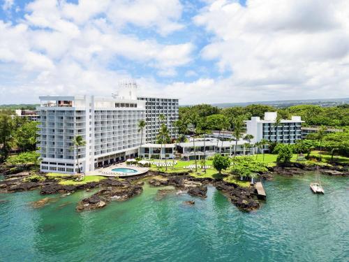 an aerial view of a hotel and the water at Grand Naniloa Hotel, a Doubletree by Hilton in Hilo