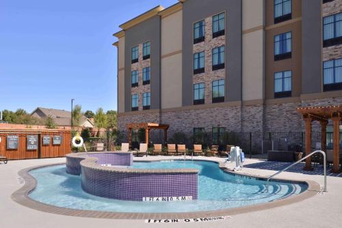 a swimming pool in front of a hotel at Homewood Suites by Hilton Trophy Club Southlake in Trophy Club