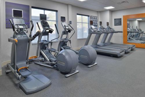 a gym with several cardio machines in a room at Homewood Suites by Hilton Trophy Club Southlake in Trophy Club