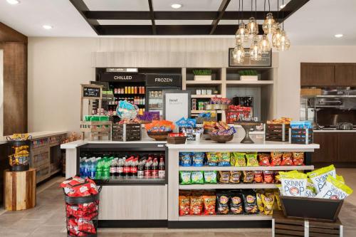 a grocery store aisle with food on display at Hilton Garden Inn Houston-Baytown in Baytown