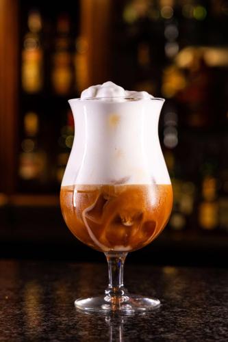 a drink with whipped cream in a glass at Radisson Blu Martinez Beirut in Beirut