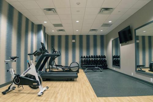 a gym with treadmills and exercise bikes in a room at Hilton Garden Inn Spartanburg in Spartanburg