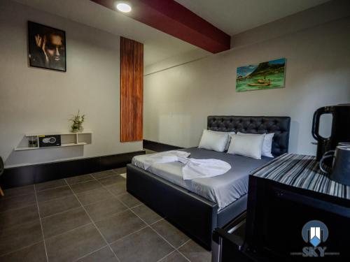 a bedroom with a bed in a room at Luxury Sky Residence Studio Apartment in Paramaribo
