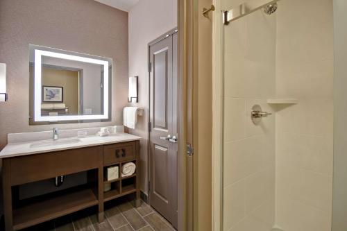 a bathroom with a sink and a shower at Homewood Suites By Hilton Orange New Haven in Orange
