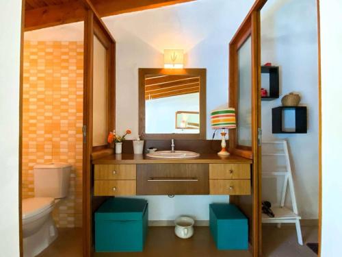 a bathroom with a sink and a mirror at Charming House in Águeda with Private Pool in Aguda