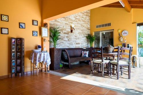 a dining room with a table and chairs at 5 bedrooms house with private pool terrace and wifi at Agueda in Aguda