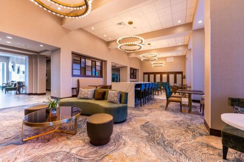 an office lobby with a couch and a table at Hampton Inn & Suites Sugar Land, Tx in Sugar Land