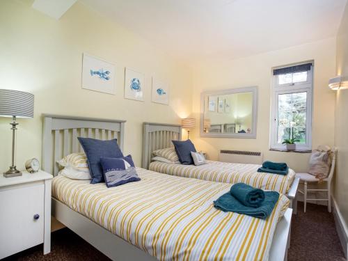 Łóżko lub łóżka w pokoju w obiekcie Seaview Palms