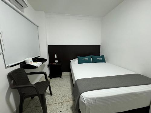 Una cama o camas en una habitación de Hotel Mar Inn Cali