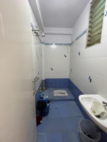 a bathroom with a toilet and a sink at rajul flats adarsh nagar jabalpur in Jabalpur