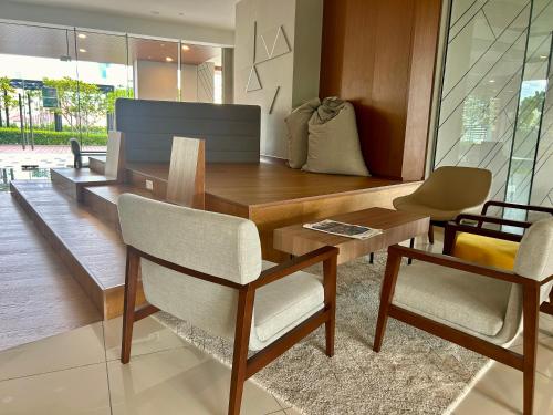 a dining room with a wooden table and chairs at SS KL Sentral by NomadNest in Kuala Lumpur