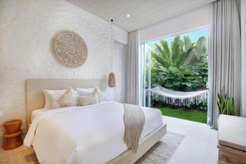 Tempat tidur dalam kamar di Matanai Villas