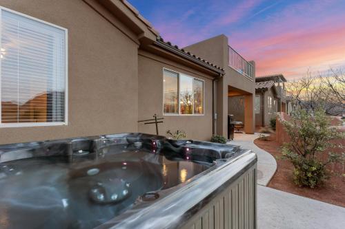 a jacuzzi tub in front of a house at My Husband Wishes he could Stay Here #14 home in Santa Clara