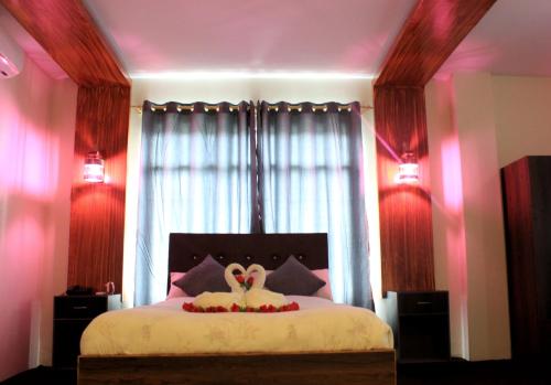 เตียงในห้องที่ Hotel Grill Durbar