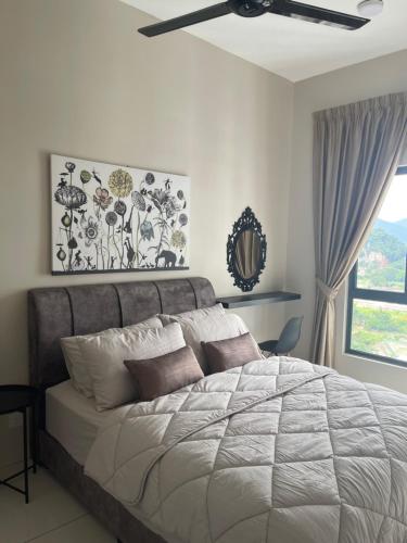 a bedroom with a large bed and a window at DnQ Homestay at The Horizon with Netflix, LG Purifier,Wifi in the Centre of Ipoh in Ipoh