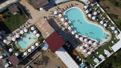 an overhead view of a pool at a resort at All'Ombra Del Noce B&B in Catona