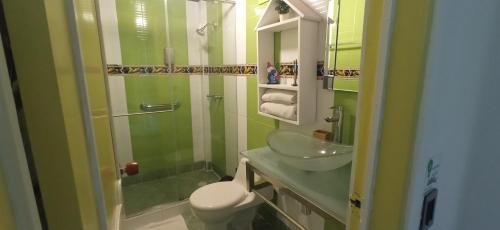 a bathroom with a sink and a toilet and a shower at Casa Salento in Salento