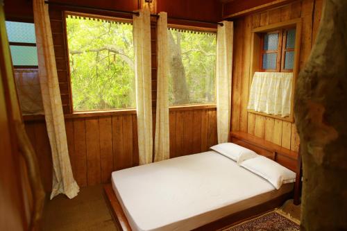 Un pat sau paturi într-o cameră la Cure Monastery