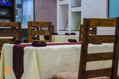 a table with two chairs and a table with shoes on it at 5 PM Hotel in Nairobi