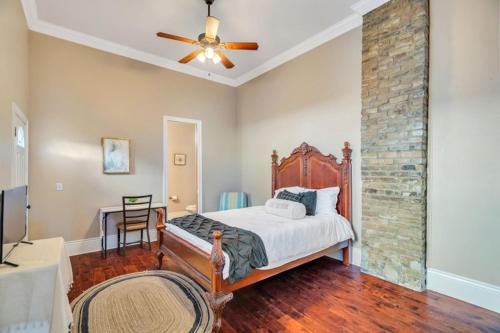 a bedroom with a bed and a ceiling fan at Spacious Centrally Located Home in New Orleans