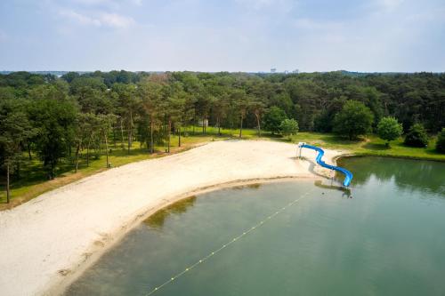 an aerial view of a body of water at Glamping Limburg in Oostrum