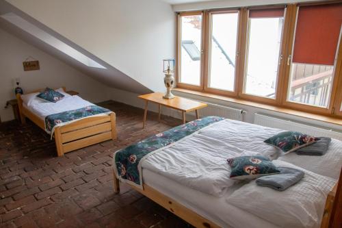 Postel nebo postele na pokoji v ubytování Podkroví v Kabinetu CB