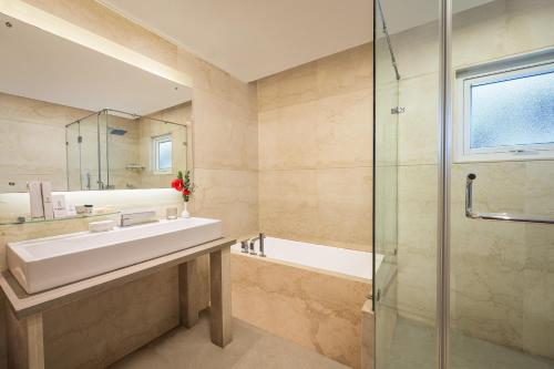a bathroom with a sink and a shower at Fortune Hosur - Member ITC's Hotel Group in Hosūr