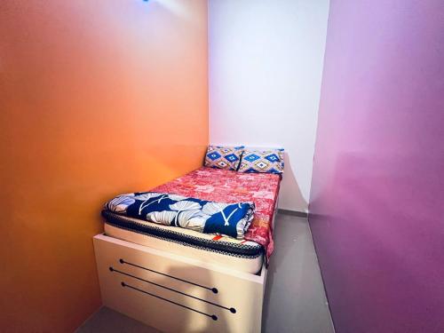 a small bed sitting on top of a cabinet in a room at Moon Backpackers Burjman Exit 2, Family Partitions, Loft partitions, in Dubai