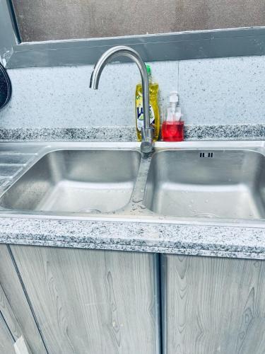 a sink in a kitchen with a counter at Moon Backpackers Burjman Exit 2, Family Partitions, Loft partitions, in Dubai