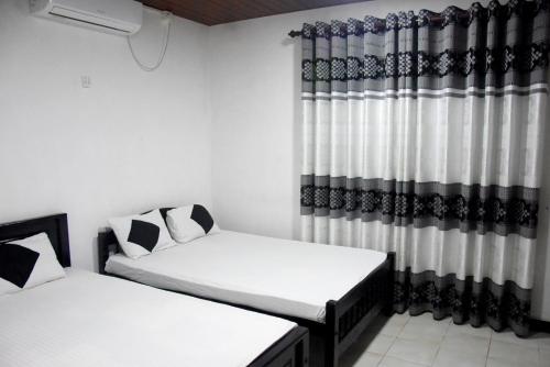 Säng eller sängar i ett rum på Penasara Holiday Home