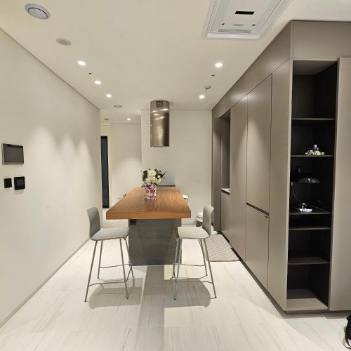 a kitchen and dining room with a table and chairs at Domus in Seoul