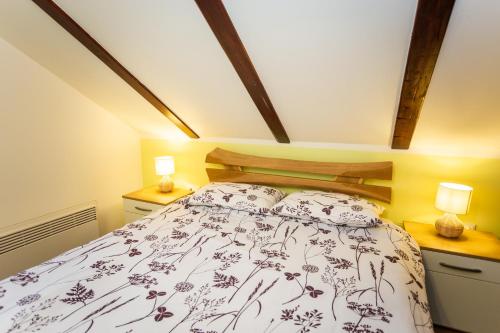 a bedroom with a bed and two night stands at Zagorska Klet in Gorjakovo