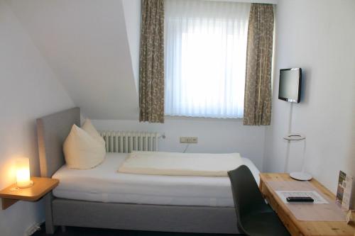 Katil atau katil-katil dalam bilik di Mittelrhein Pension