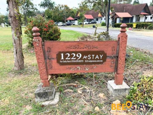 a sign on the side of a street at Melaka Afamosa DAmour Villa 12PAX with Private Pool & BBQ in Kampong Alor Gajah