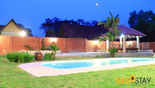 a swimming pool in the yard of a house at Melaka Afamosa DAmour Villa 12PAX with Private Pool & BBQ in Kampong Alor Gajah