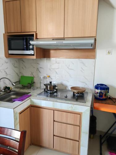Кухня или мини-кухня в Sweet House Homestay Near Mall Pekanbaru Sudirman
