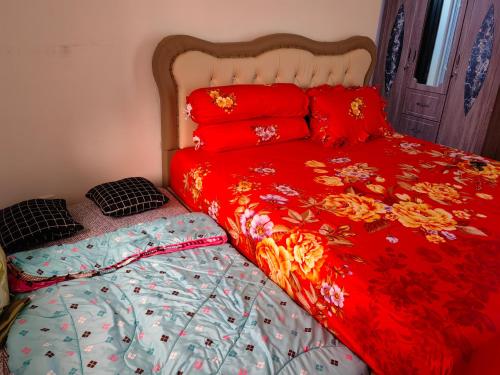 Кровать или кровати в номере Sweet House Homestay Near Mall Pekanbaru Sudirman