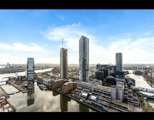 an aerial view of a city with a river and buildings at Trendy, modern 2 bed apartment! in London
