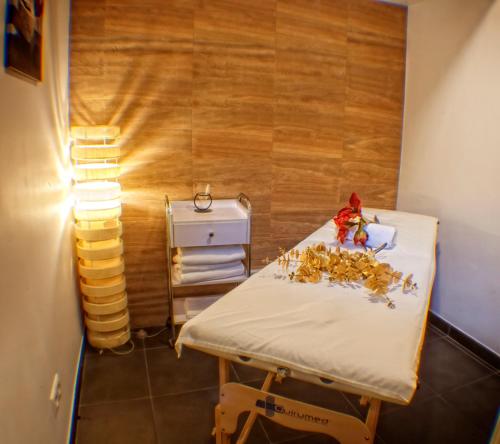 a room with a hospital bed with a doll on it at Hotel Spa El Muelle de Suances in Suances