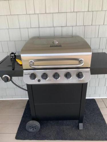 a stove top oven sitting on a counter in a kitchen at Cozy Beach - Direct Waterfront! in East Haven