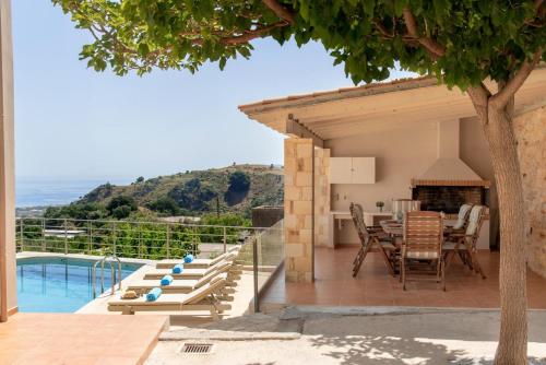 a villa with a view of the ocean at Le Stelle Villa in Georgioupolis