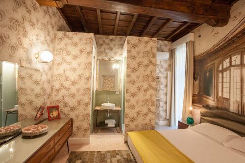 a bedroom with a bed and a sink in it at 59 Steps Trevi in Rome