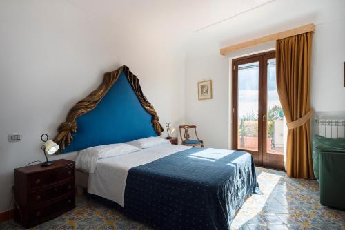 Ένα ή περισσότερα κρεβάτια σε δωμάτιο στο Villa Magnifico