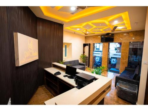 an office with a desk and chairs in a room at HOTEL JSR KEDAR in Varanasi