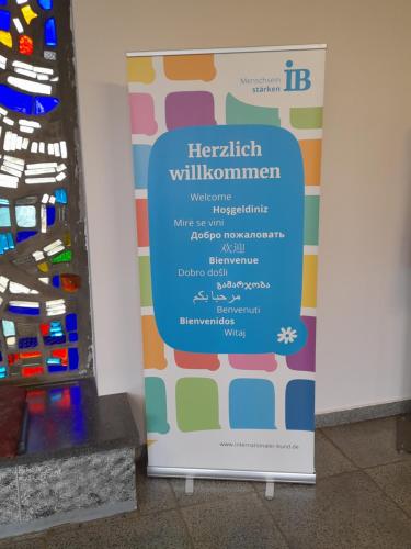 a sign in a room next to a wall at Internationales Gästehaus in Jena