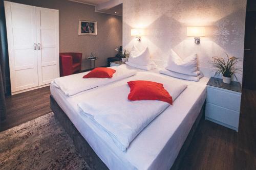 Postel nebo postele na pokoji v ubytování Gartenstadt Hotel