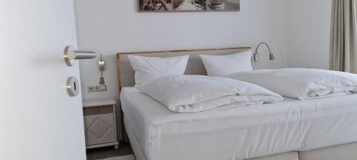 Postel nebo postele na pokoji v ubytování Kaiserhof Kaiserhof 83