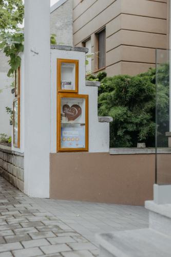 a sign on the side of a building at Weingut und Gästehaus Salzl in Illmitz