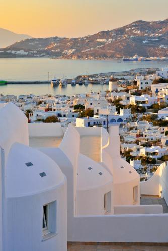 a view of a city with white buildings at Pelican Hotel in Mýkonos City