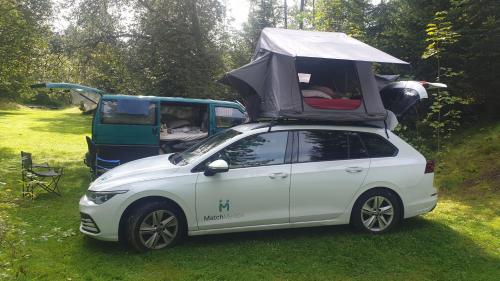 a small white car with a tent on top of it at Harzklub Wanderheim in Wildemann